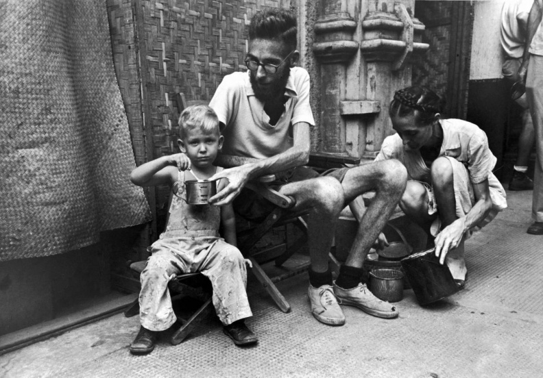 1945 Santo Tomas Father-feeding-boy